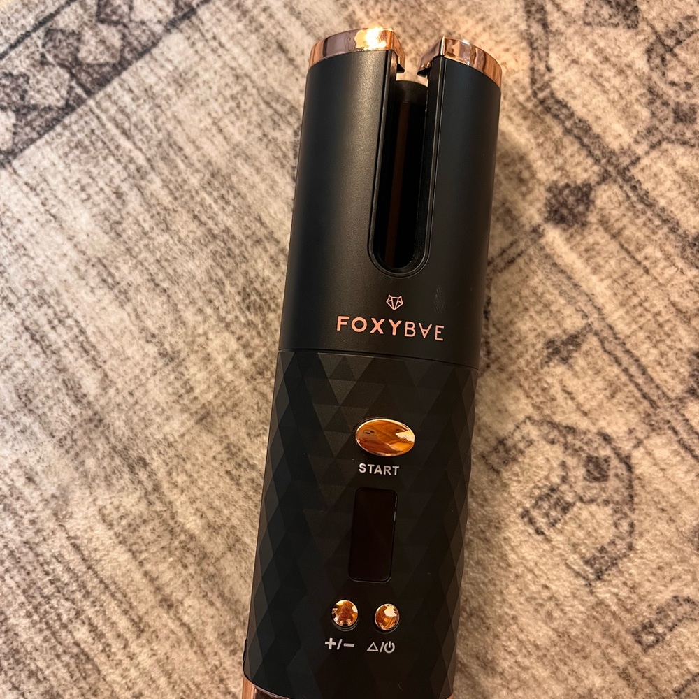Rose gold cordless hair curler by Roxy Bae.
